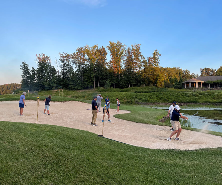 golfers in a sand bunker